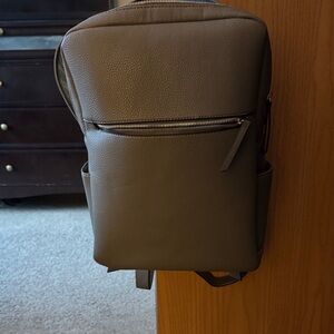 Stylish grayish women’s Backpack, good for school,office or diaper bag.